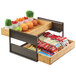 A Cal-Mil Sierra bronze metal and rustic pine 2-tier merchandiser rack on a counter with fruit and vegetables in it.