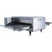 A TurboChef conveyor oven with a split belt and a lid open.