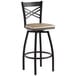 A Lancaster Table & Seating black and wood bar stool with a backrest and wooden seat.