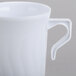 A close up of a Fineline white plastic coffee mug with a handle.