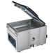 A Hamilton Beach PrimaVac 406 stainless steel chamber vacuum sealer with the lid open.