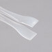 A pair of clear plastic tongs with toothpick ends.