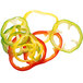 A group of sliced peppers on a white background using a Robot Coupe 5/64" Slicing Disc.