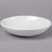 An American Metalcraft Cloud Coupe melamine bowl on a gray surface.