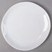 An American Metalcraft white melamine plate with a round rim.