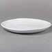 An American Metalcraft Crave Cloud Coupe melamine plate with a curved edge on a gray background.