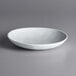 An American Metalcraft Crave white melamine bowl on a gray surface.