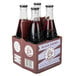 A six pack of Boylan Black Cherry Soda bottles.