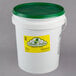 A white bucket with a green lid.