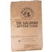 A brown bag of King Arthur Flour Sir Galahad Artisan Flour.