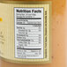 The label on a jar of Kime's Cinnamon Applesauce with food information.
