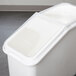 A white plastic container with clear lid for Cambro IBS Ingredient Bins.