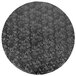 A white circular surface with a pattern of black flowers.