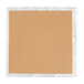 A brown cardboard square with silver foil.
