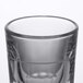 A close up of a Libbey fluted shot glass with a pour line.