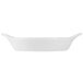 A white rectangular shirred egg dish with handles.