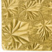 A gold square cake board with embossed leaves and flowers.