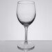 A close-up of a Libbey Bristol Valley chalice wine glass on a reflective surface.