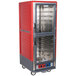 A red and silver Metro C5 moisture heated holding and proofing cabinet with clear Dutch doors.