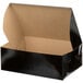 A black Enjay cardboard box with the lid open.