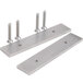 A group of metal plates with screws and two stainless steel brackets.