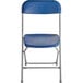 A blue Lancaster Table & Seating folding chair with metal legs.