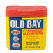 A yellow container of Old Bay Seasoning with a red lid.