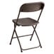 A brown Lancaster Table & Seating folding chair with a metal frame and a backrest.