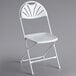 A white Lancaster Table & Seating folding chair with a fan shaped back.