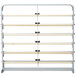 A gray metal rack with wooden bars for holding paper rolls.