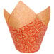 A white Enjay cupcake wrapper with orange and yellow tulip print.