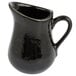 An American Metalcraft black ceramic pitcher with a handle.