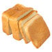 A close up of a European Bakers white bread loaf with four slices cut off.