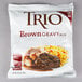 A package of Trio brown gravy mix on a gray background.