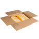 A white cardboard box with yellow and white food inside.