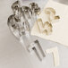 A set of Ateco stainless steel number cookie cutters on a white surface.