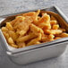 A metal container filled with Misty Harbour breaded fried clam strips on a counter.