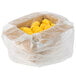 A plastic bag filled with yellow scrambled egg patties.