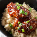A bowl of rice and chicken with Sweet Baby Ray's Sweet Teriyaki Wing Sauce and Glaze.