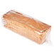 A European Bakers whole wheat bread loaf wrapped in plastic.