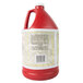 A white jug of red liquid with a white label for Wright's Hickory Liquid Smoke.