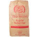 A brown bag of grain millers regular rolled oats with red and white label.