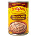 A white bowl filled with Old El Paso Refried Beans next to a can of Old El Paso Refried Beans.