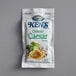 A white package of Ken's Creamy Caesar Dressing packets with a picture of a caesar salad.
