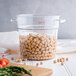 A clear container filled with Jack Rabbit dry garbanzo beans.