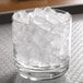 A glass of ice with Hoshizaki cubelet ice in it.