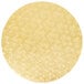 A circular gold surface with floral designs.