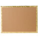 A brown cardboard cake board with gold trim.