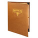 A brown leather Menu Solutions Bella Collection booklet menu cover on a table with a gold logo.