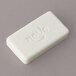 A white rectangular Novo Essentials facial soap bar wrapped in white packaging.